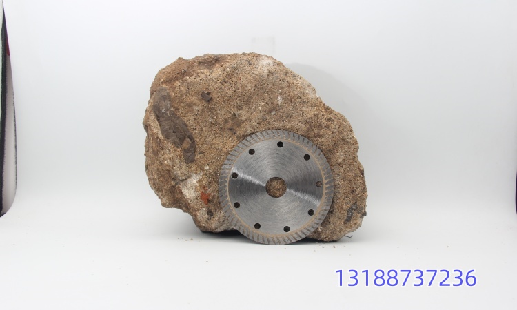 Diamond saw blade cutting granite